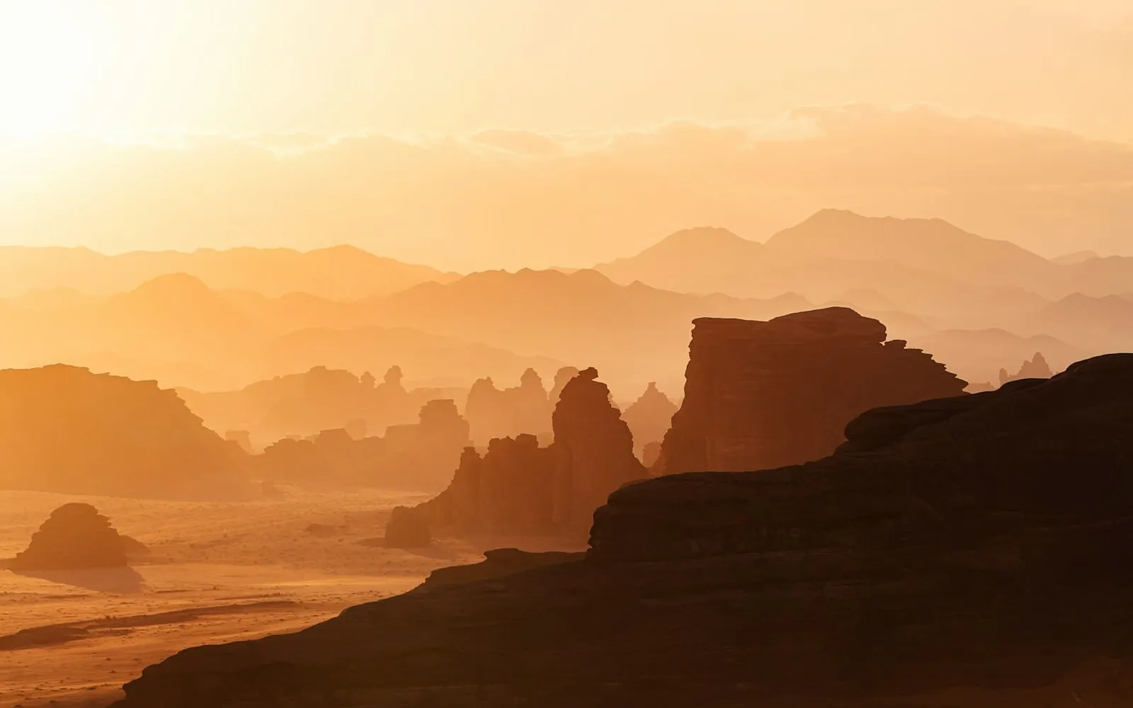 Warm light crossing a wide desert landscape